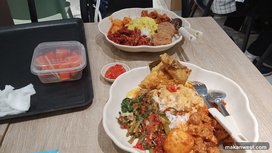 Two plates of Indonesian food