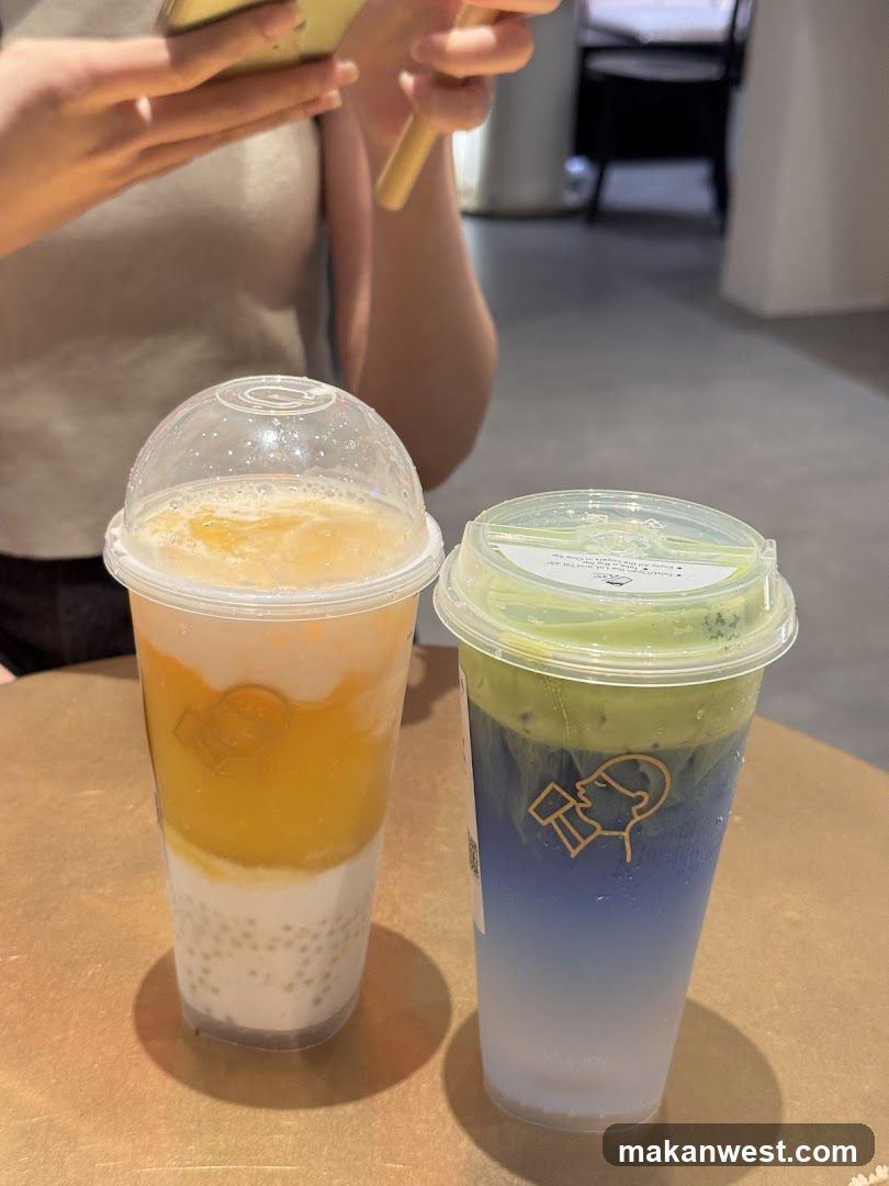 Two colorful drinks on a table