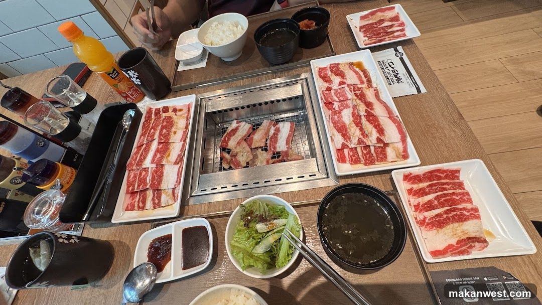 Table with grilled meat and side dishes