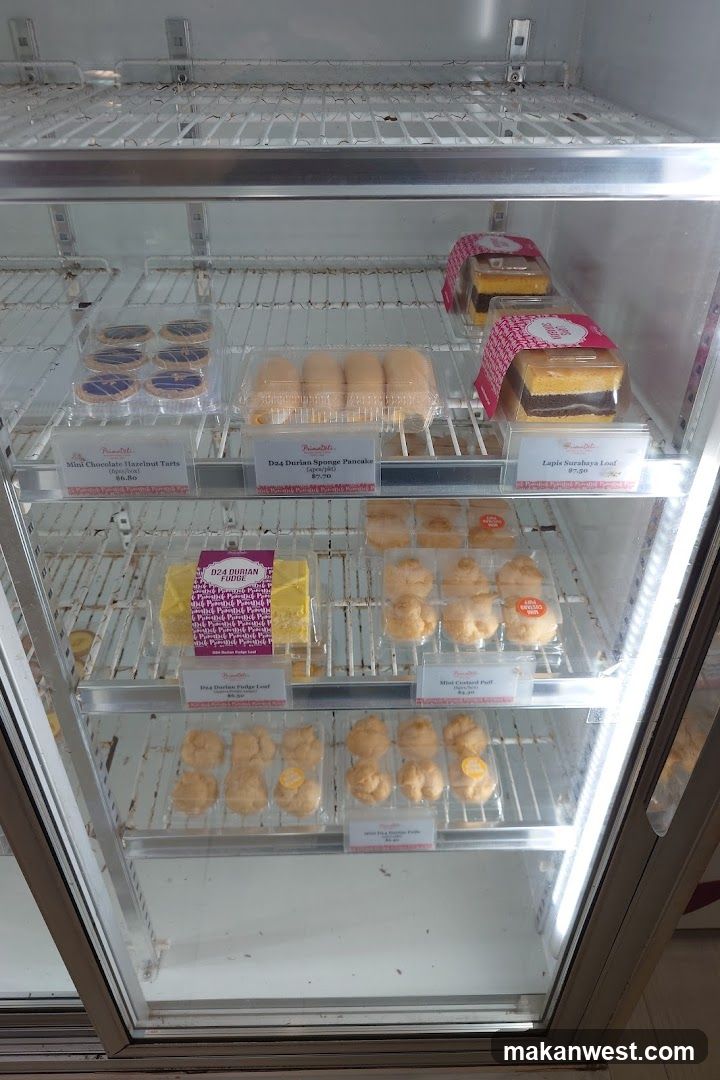 Assortment of Pastries in a Refrigerator Display