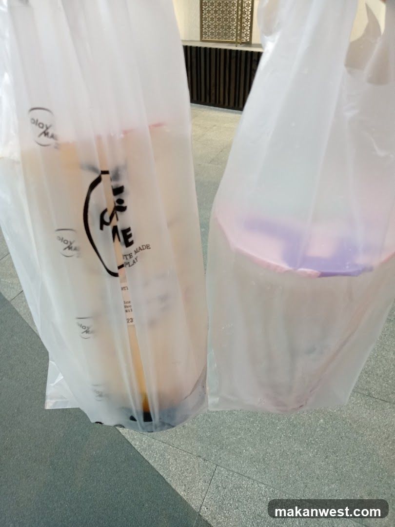 Two drinks in plastic bags