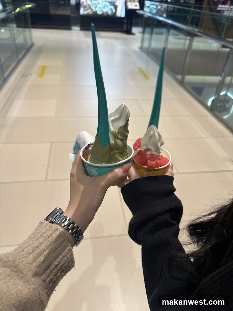 Two cups of soft serve ice cream