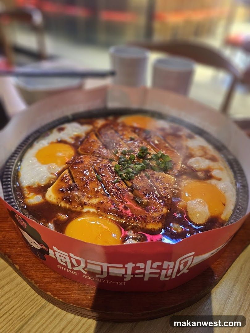 Sizzling Dish with Eggs and Meat