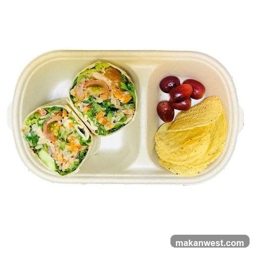 Salmon wrap with grapes and chips