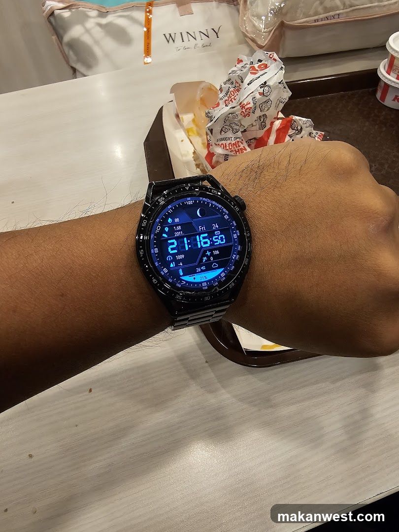 Hand wearing smartwatch at dining table