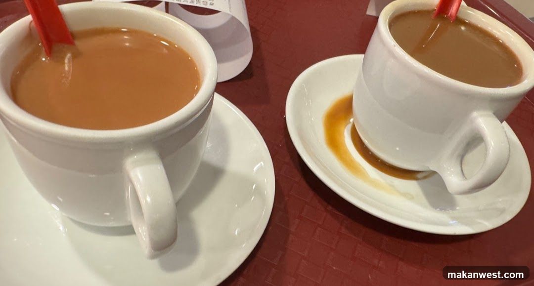 Two cups of tea on a red table