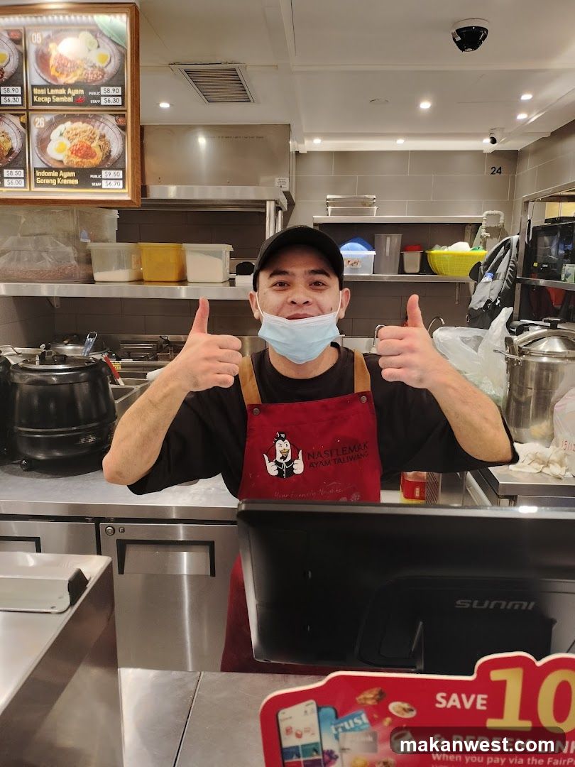 Staff in Kitchen Giving Thumbs Up