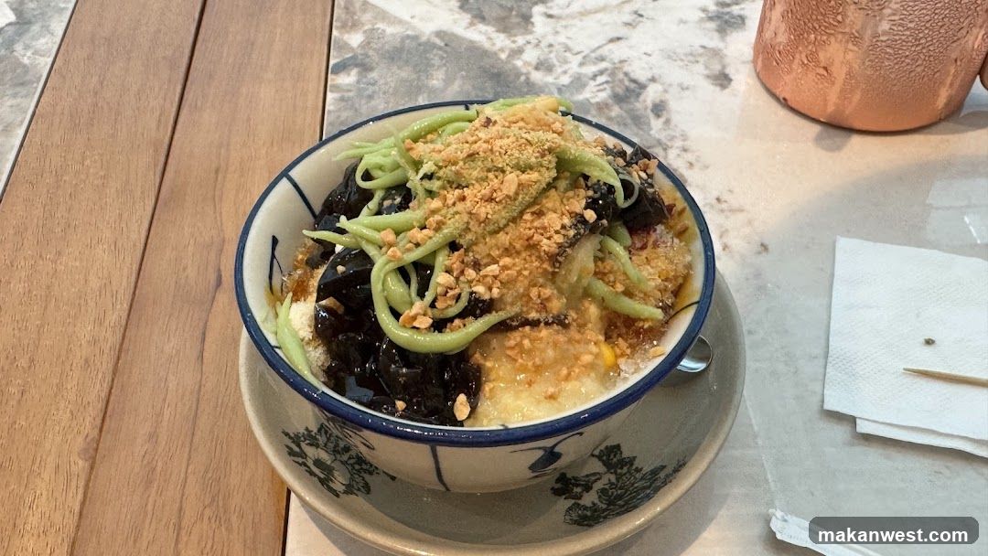 Bowl of Green Noodles with Toppings