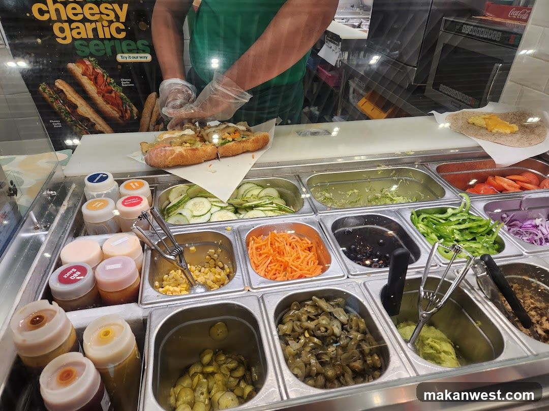 Sub Shop Counter with Ingredients and Staff