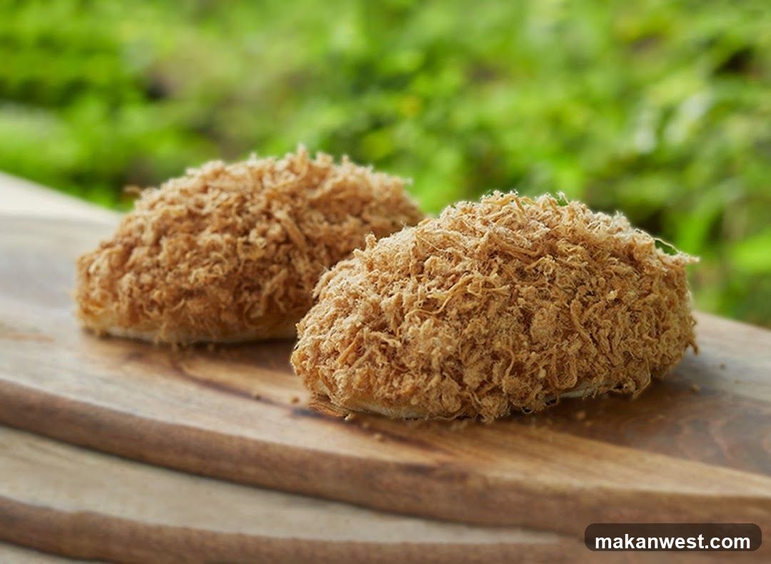 Two crispy food items on wooden board
