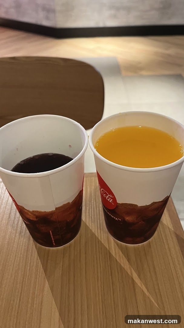 Two beverages in branded cups