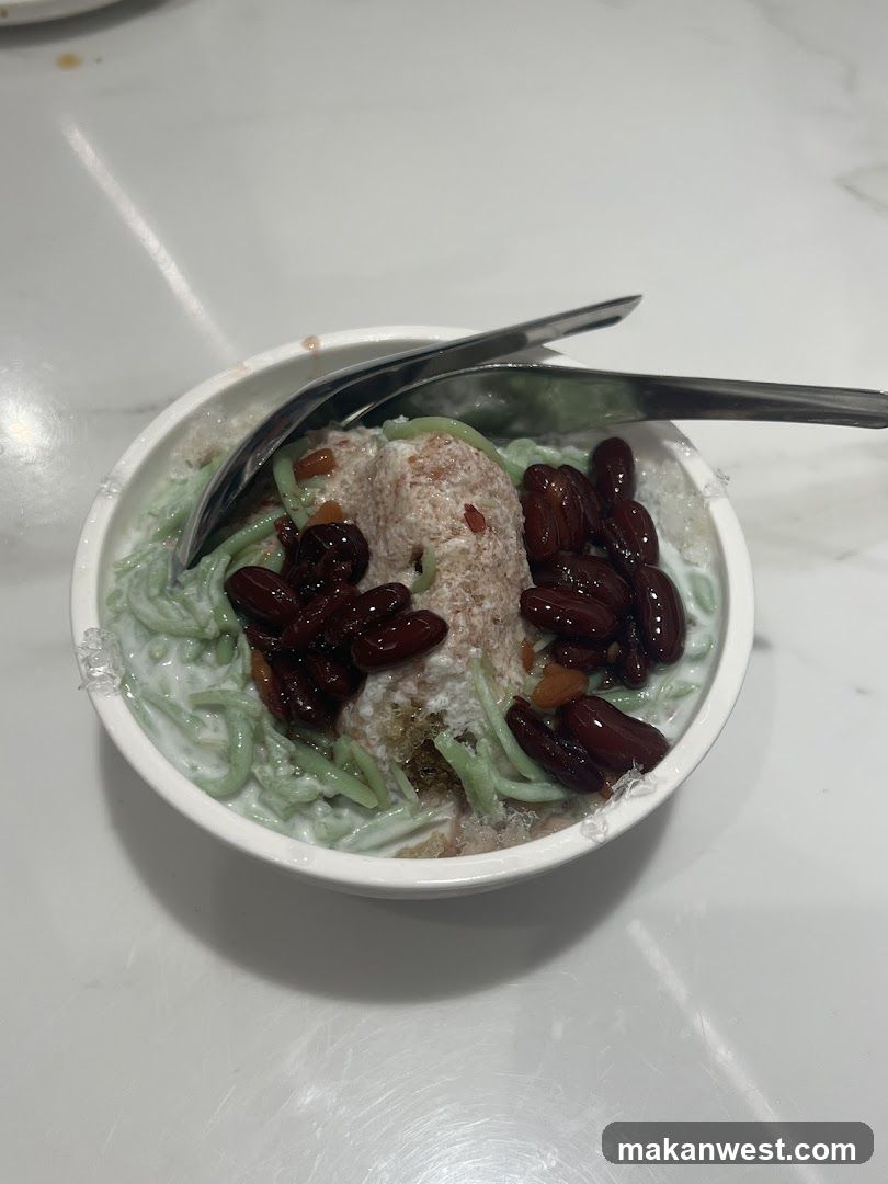 Bowl of Green Noodles with Red Beans and Coconut