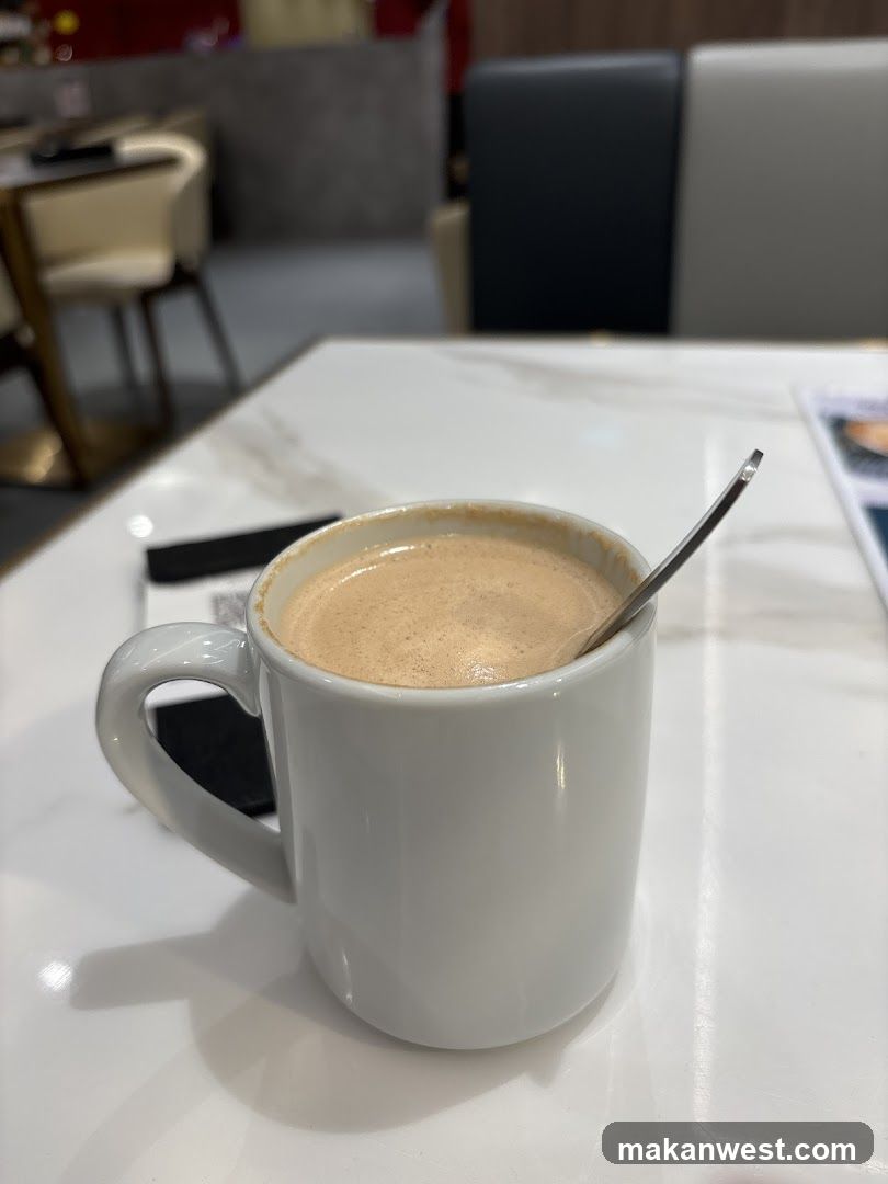 Coffee in a white mug on a marble table