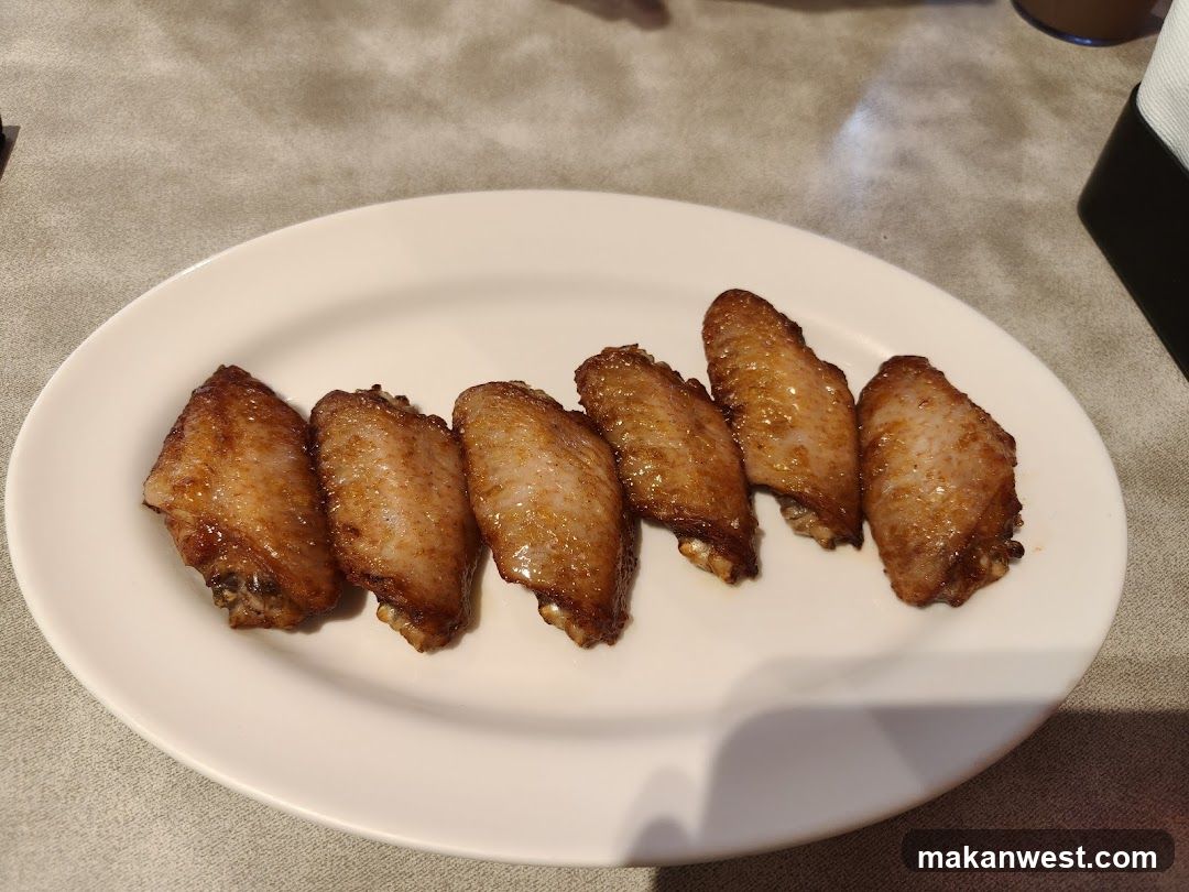 Baked Chicken Wings on a White Plate