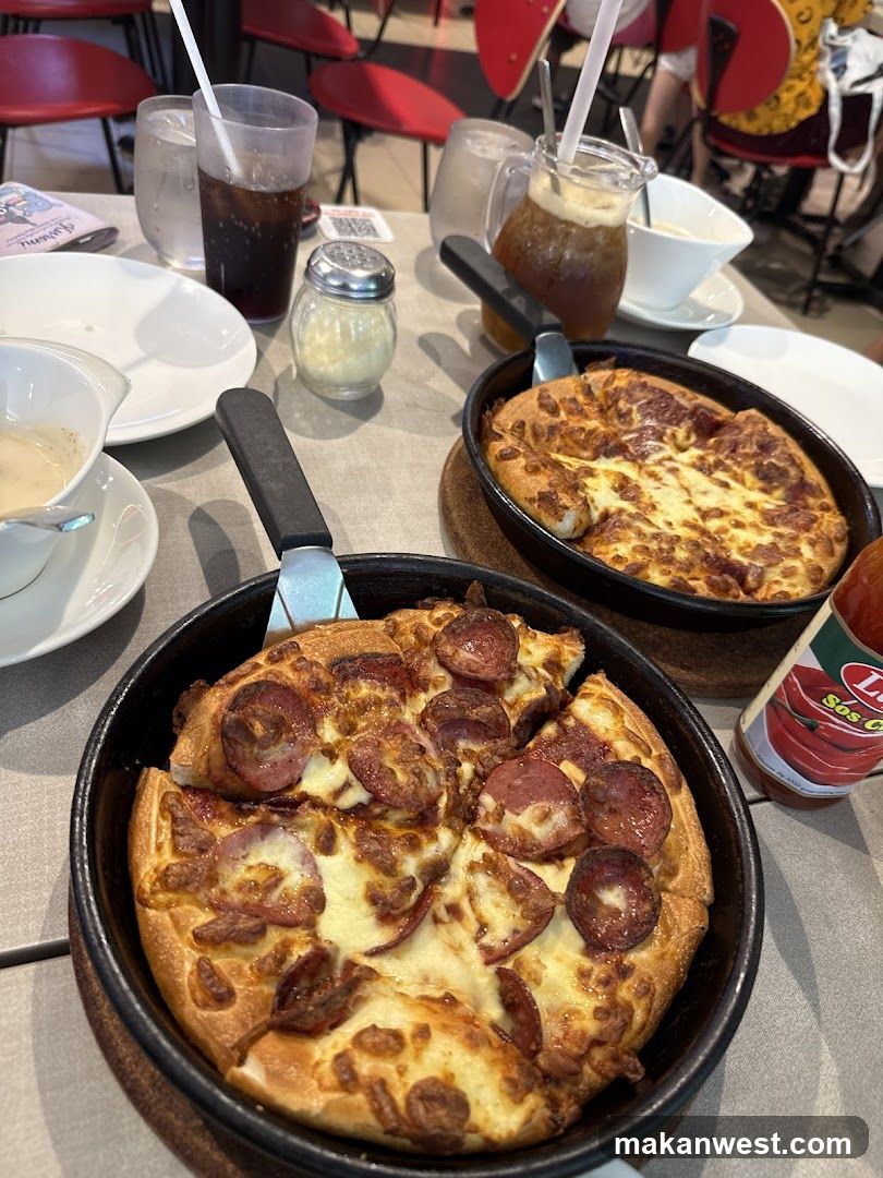 Pizza and Drinks at Restaurant Table