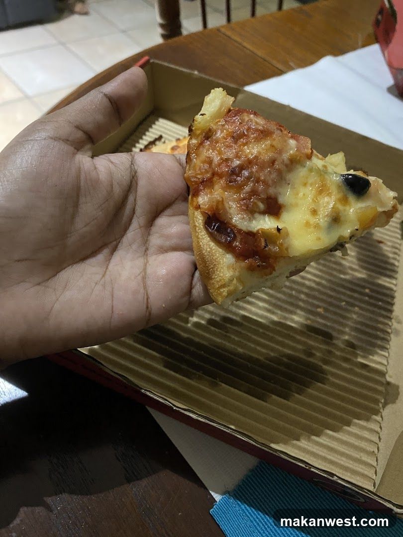 Pizza Slice in Hand