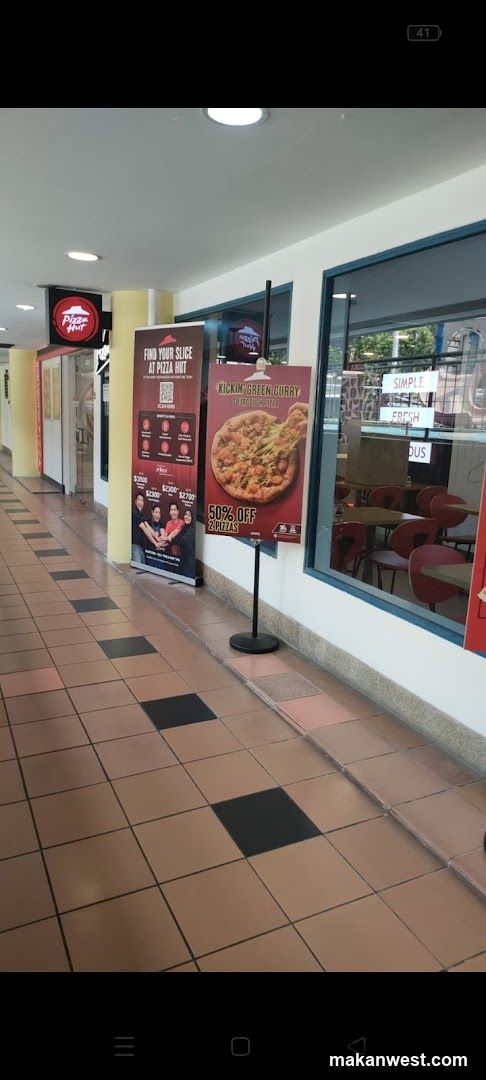 Pizza Hut Storefront with Promotional Displays