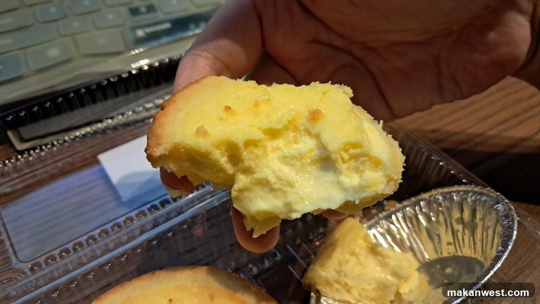 Hand Holding Cheesecake