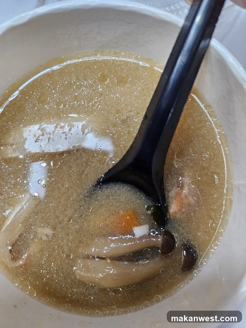 Bowl of Soup with Mushrooms and Carrots