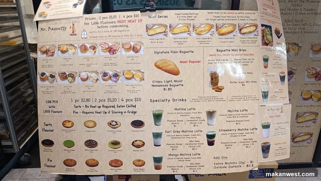 A printed menu board displaying various baked goods and drinks, including baguettes, tarts, pies, matcha lattes, and oat milk options.