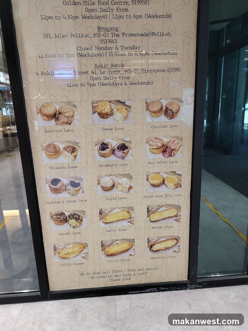 A vertical menu board displaying various baked goods with photos and names, including Basalt Lava, Cheese Lava, Chocolate Lava, Tiramisu Lava, Blueberry Lava, Red Velvet Lava, Cookies & Cream Lava, Apple Lava, Peach Aloe Vera Lava, Adzuki Lava, Garlic Toast, Butter Sugar, Garlic Cheese, French Cheese, and Hawaiian Pizza.