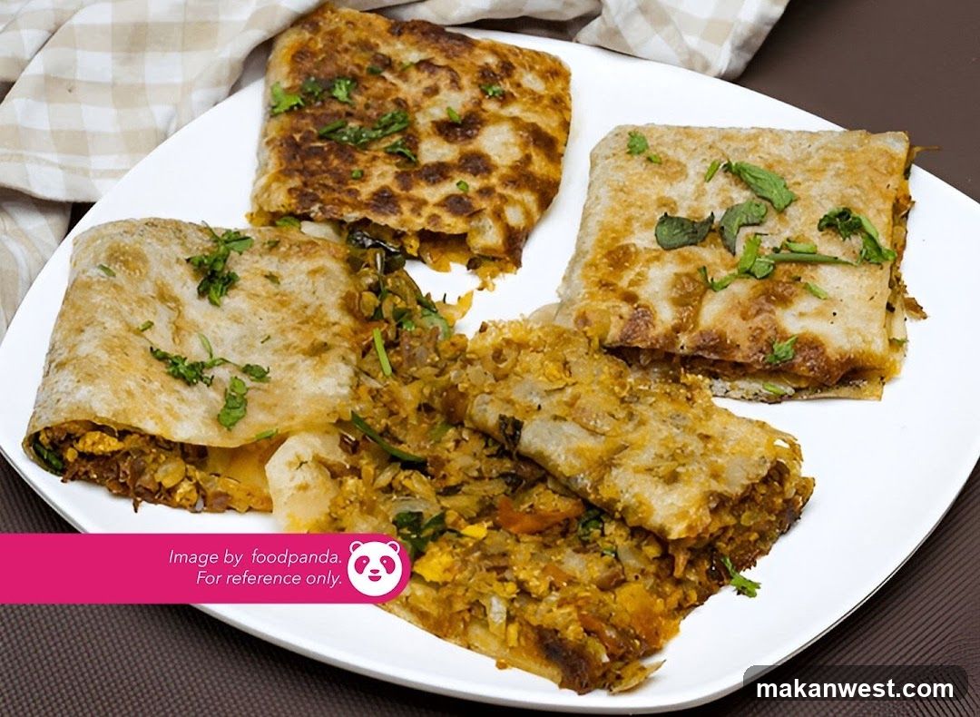 Paneer Tikka Masala or similar stuffed flatbread dish