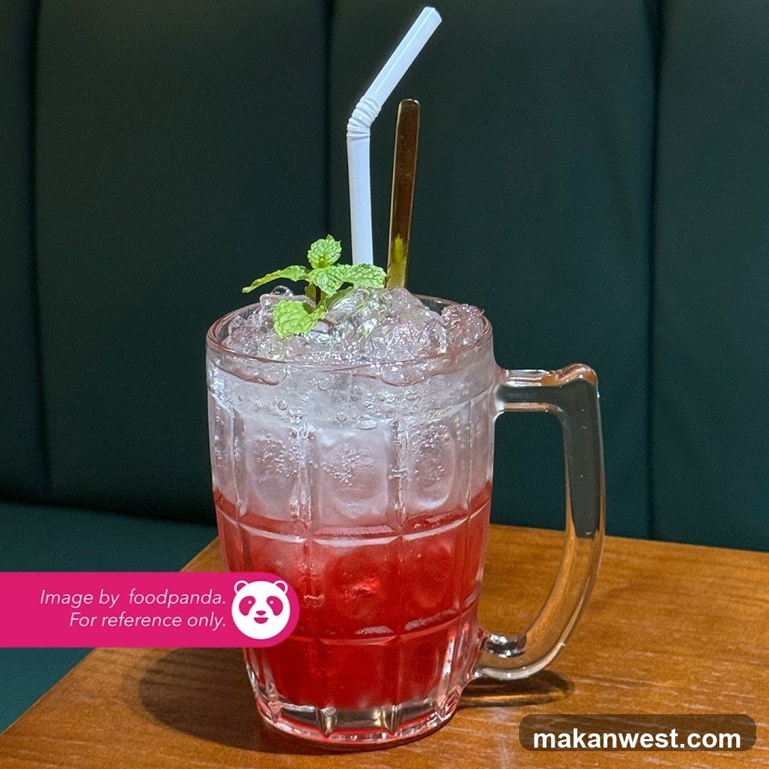 Red Iced Drink with Mint Garnish