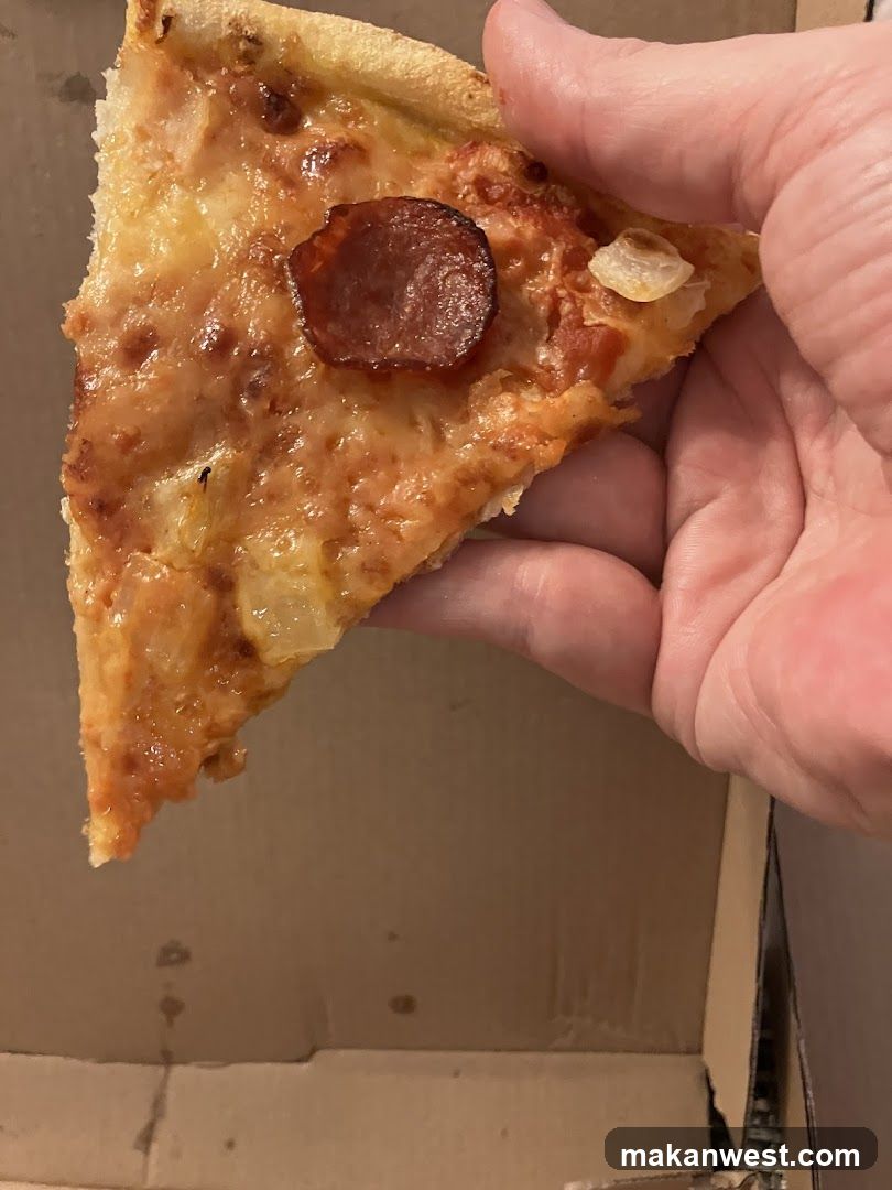Pizza Slice with Pepperoni and Onions