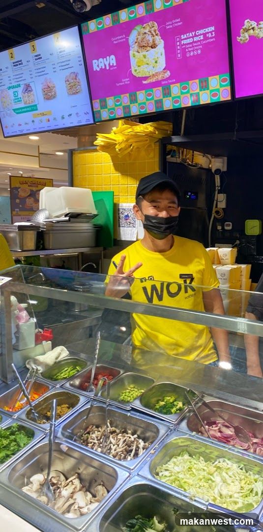 Food stall interior with staff and ingredients display