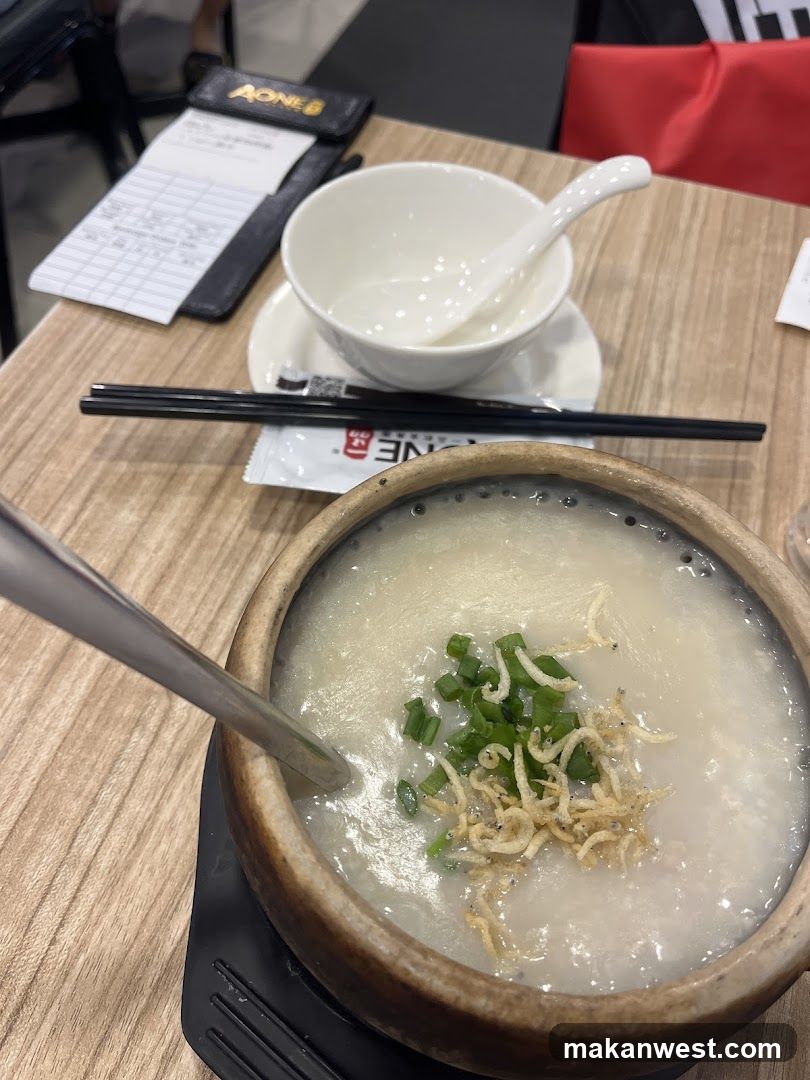 Congee with garnish in a clay pot