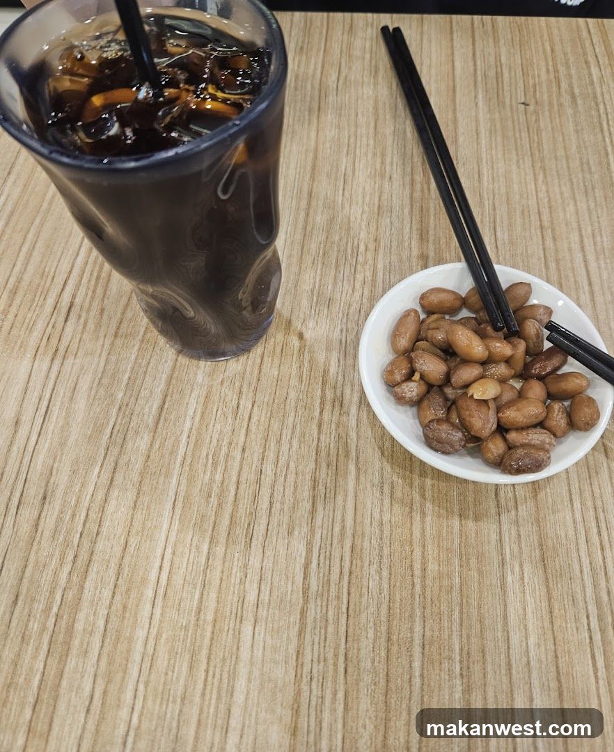 Peanuts and Iced Drink on Wooden Table