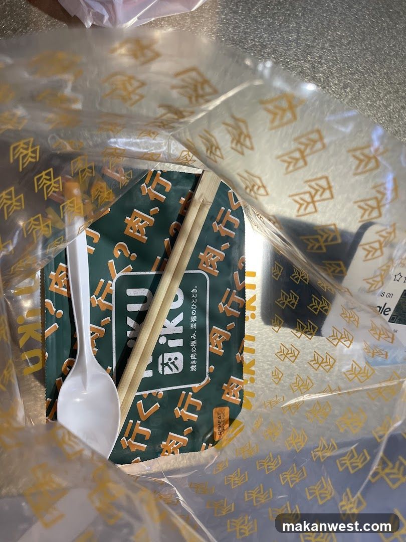 Takeout food packaging with chopsticks and spoon