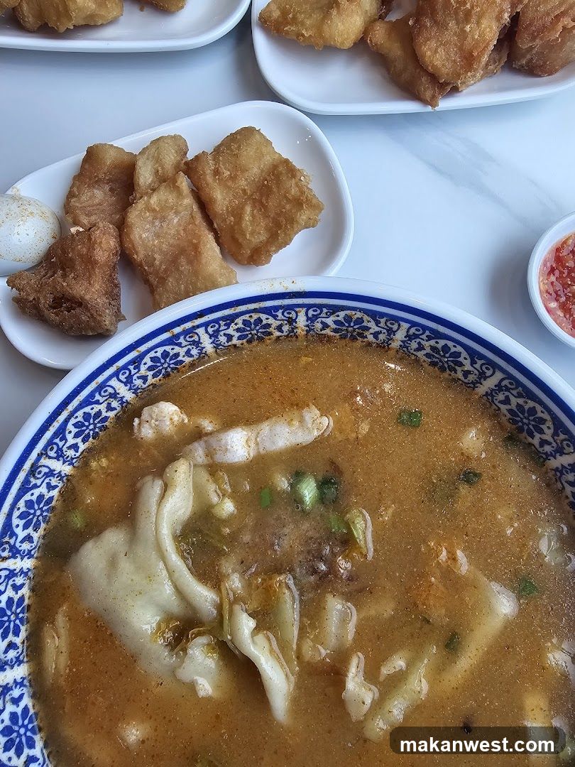 Bowl of Soup with Fried Dishes