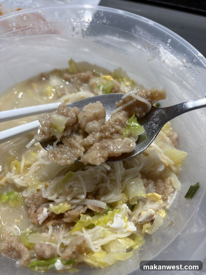 Bowl of Noodle Soup with Meat and Vegetables