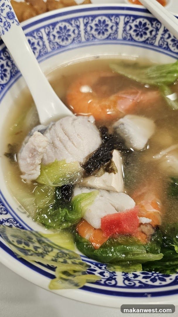 Bowl of Soup with Shrimp and Fish