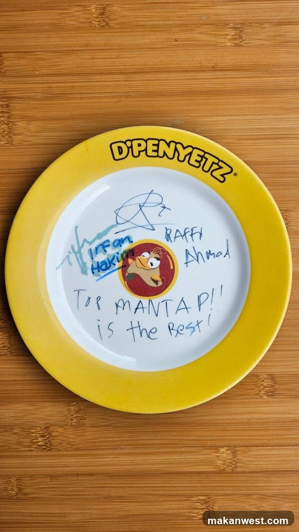 D'PENYETZ branded plate with handwritten message