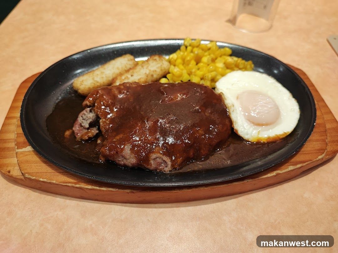 Sizzling Steak Plate with Fried Egg and Corn