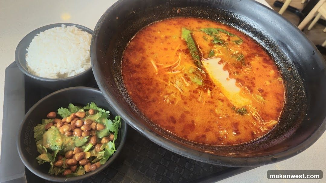 Spicy Soup Meal with Rice and Side Dish