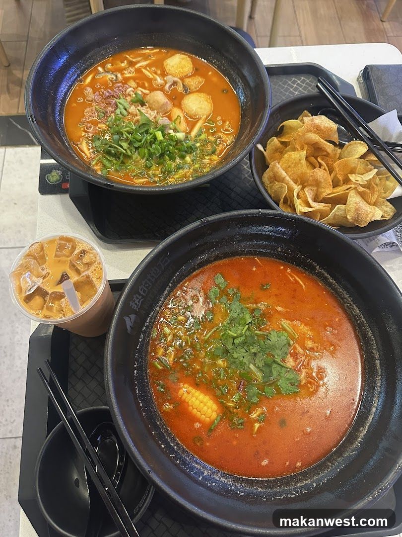 Spicy Noodle Meal with Chips and Iced Drink