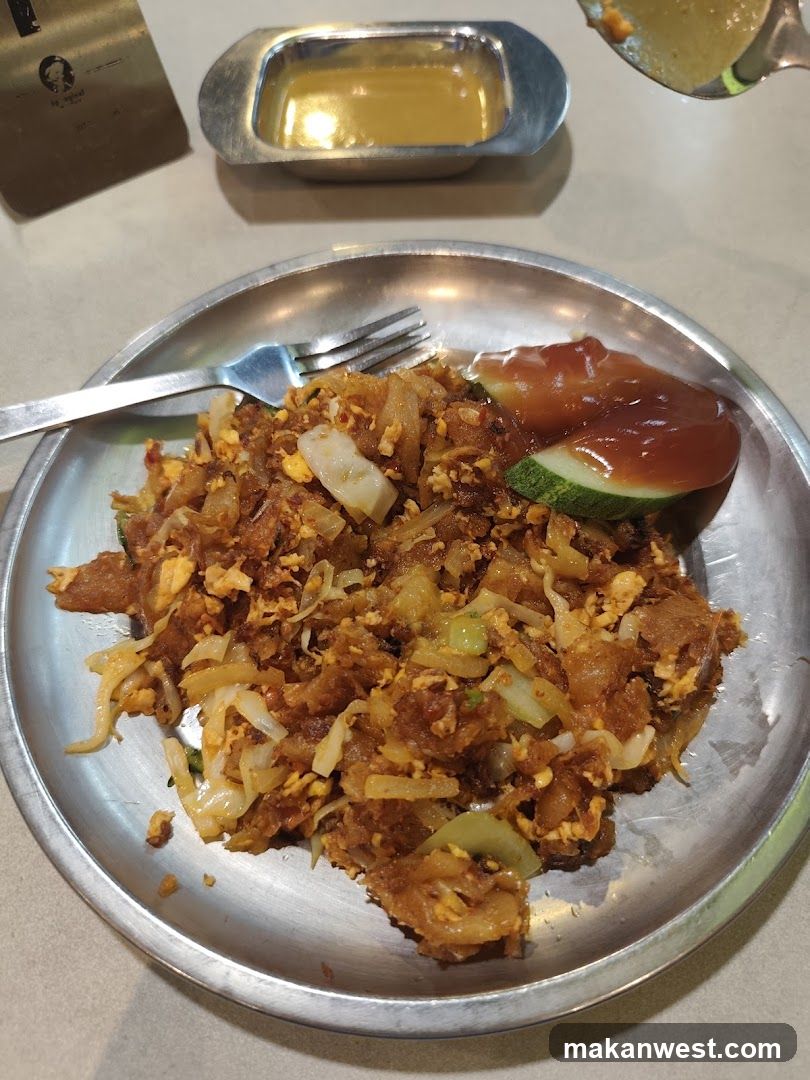 Plate of Fried Rice with Sauce and Cucumber