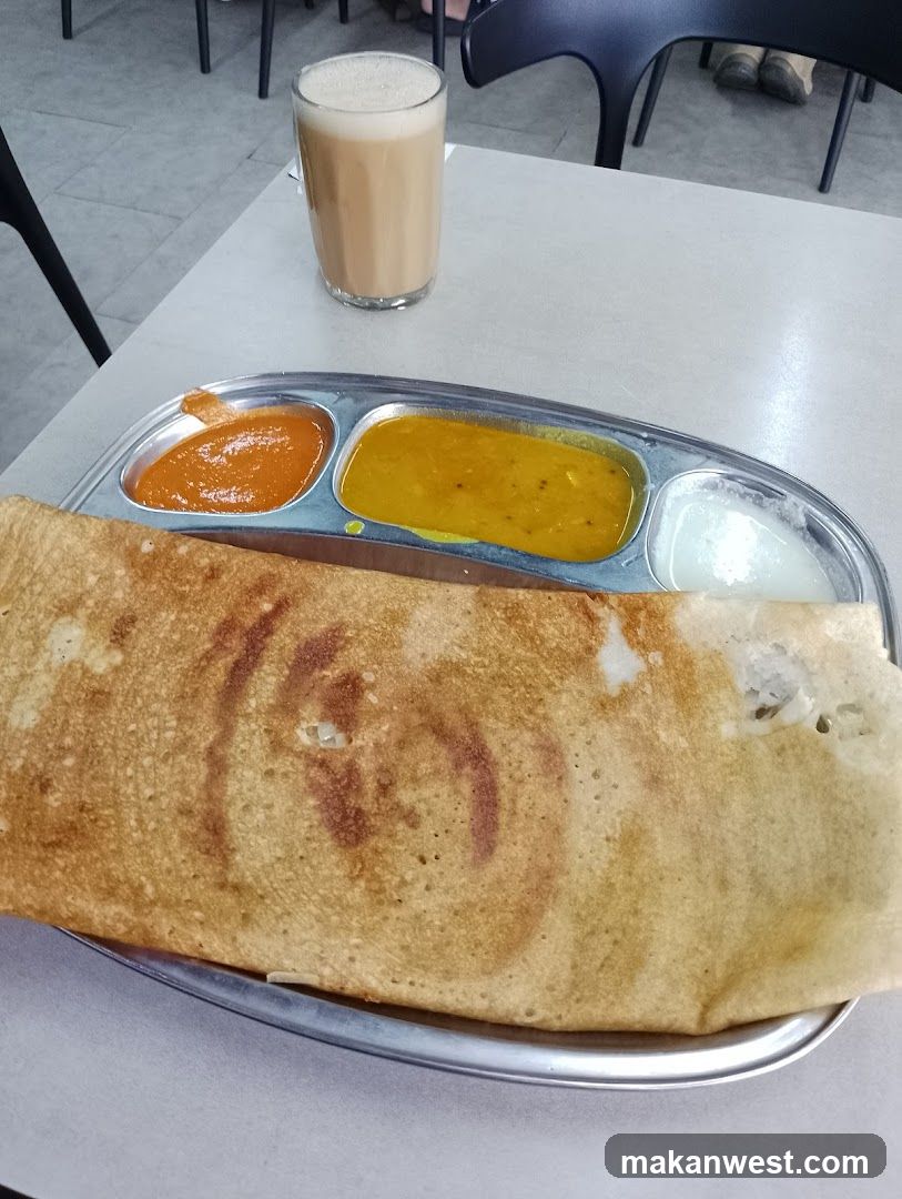 Dosa Meal with Side Dishes and Tea