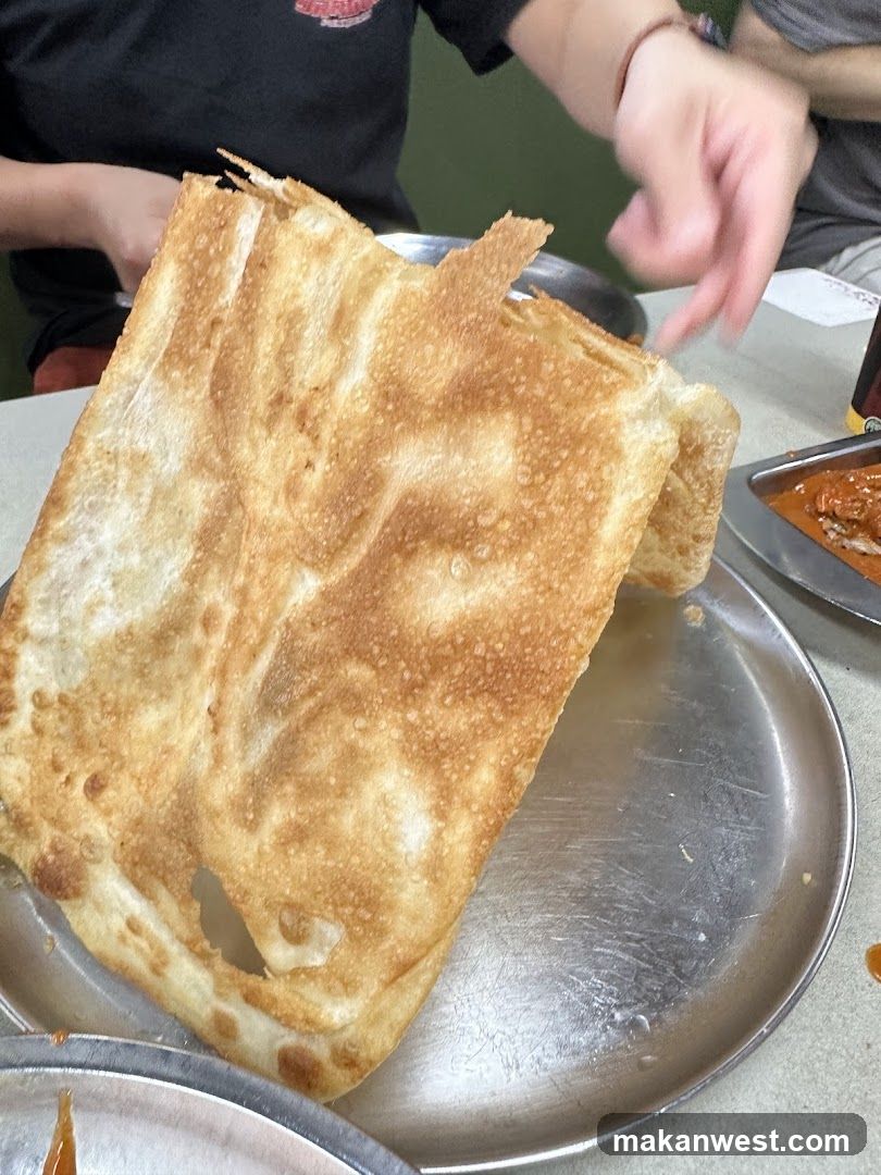 Roti Canai on a metal plate