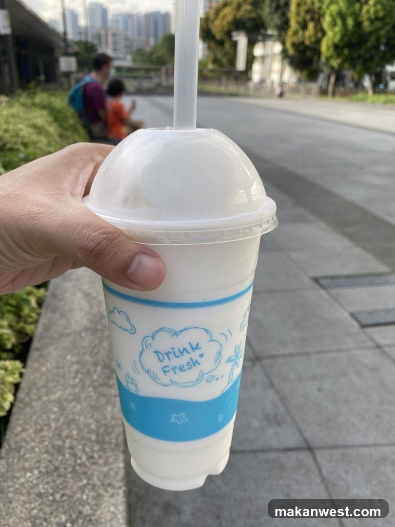 Hand holding a drink cup