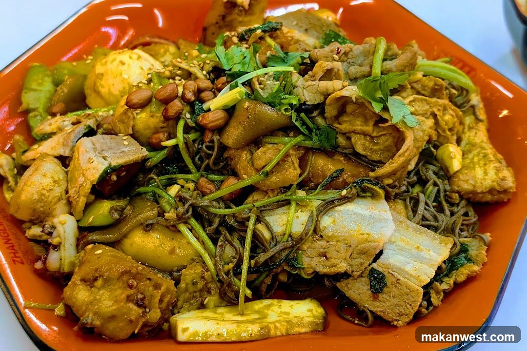 Spicy Noodle Dish with Tofu and Peanuts