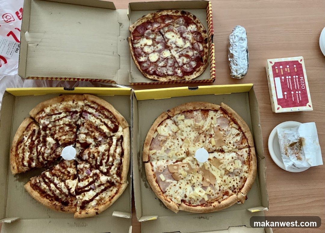 Pizza and food spread on table
