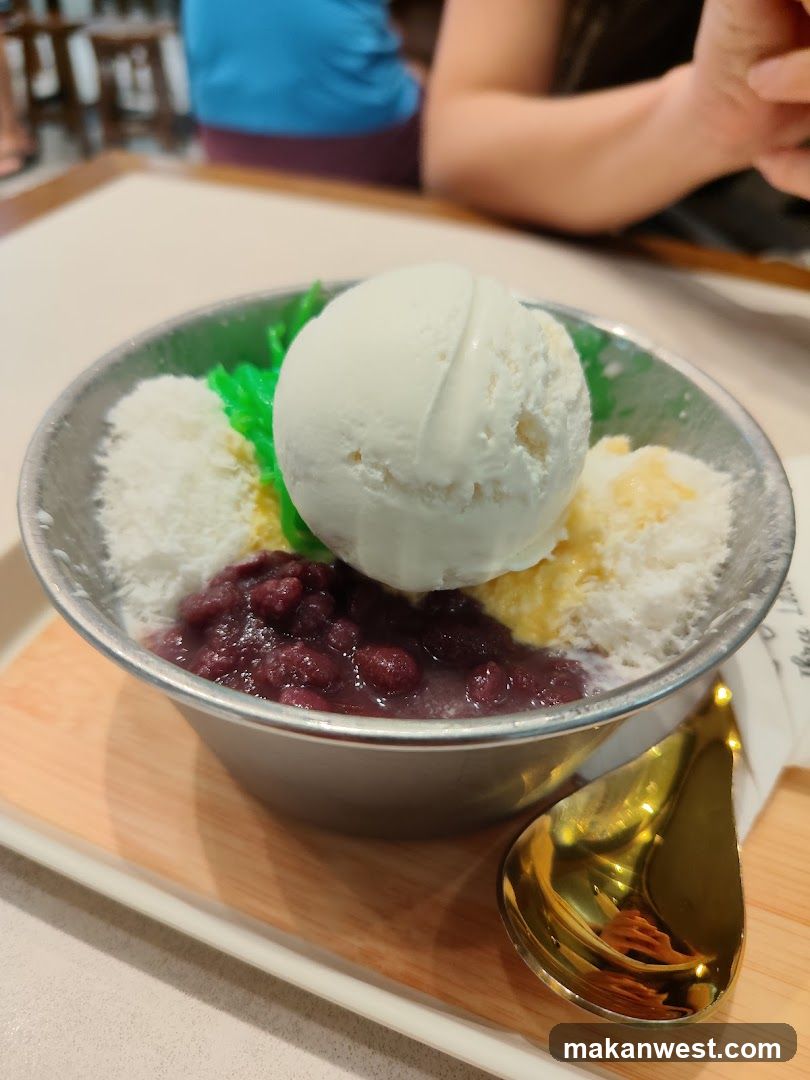 Bowl of shaved ice dessert with coconut and red beans