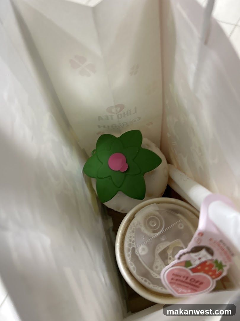 Beverage and Merchandise in Bag
