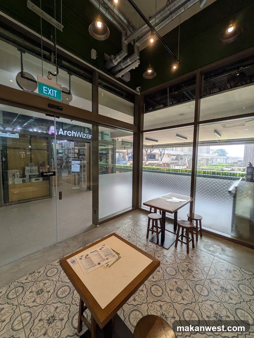 Interior of a cafe with tables and glass doors