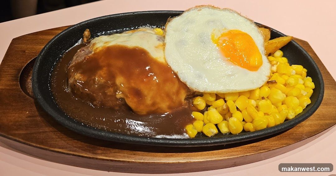 Sizzling Steak with Fried Egg and Corn