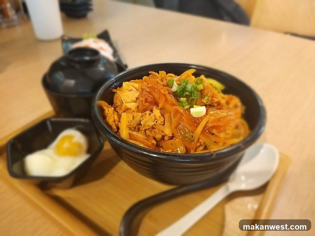 Korean-style stir-fried noodles with egg and kimchi
